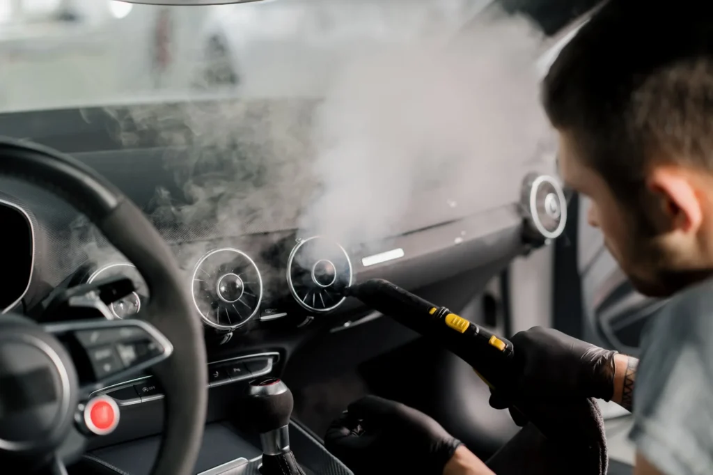 Mobile car detailing service cleaning a vehicle interior in Edmonton
